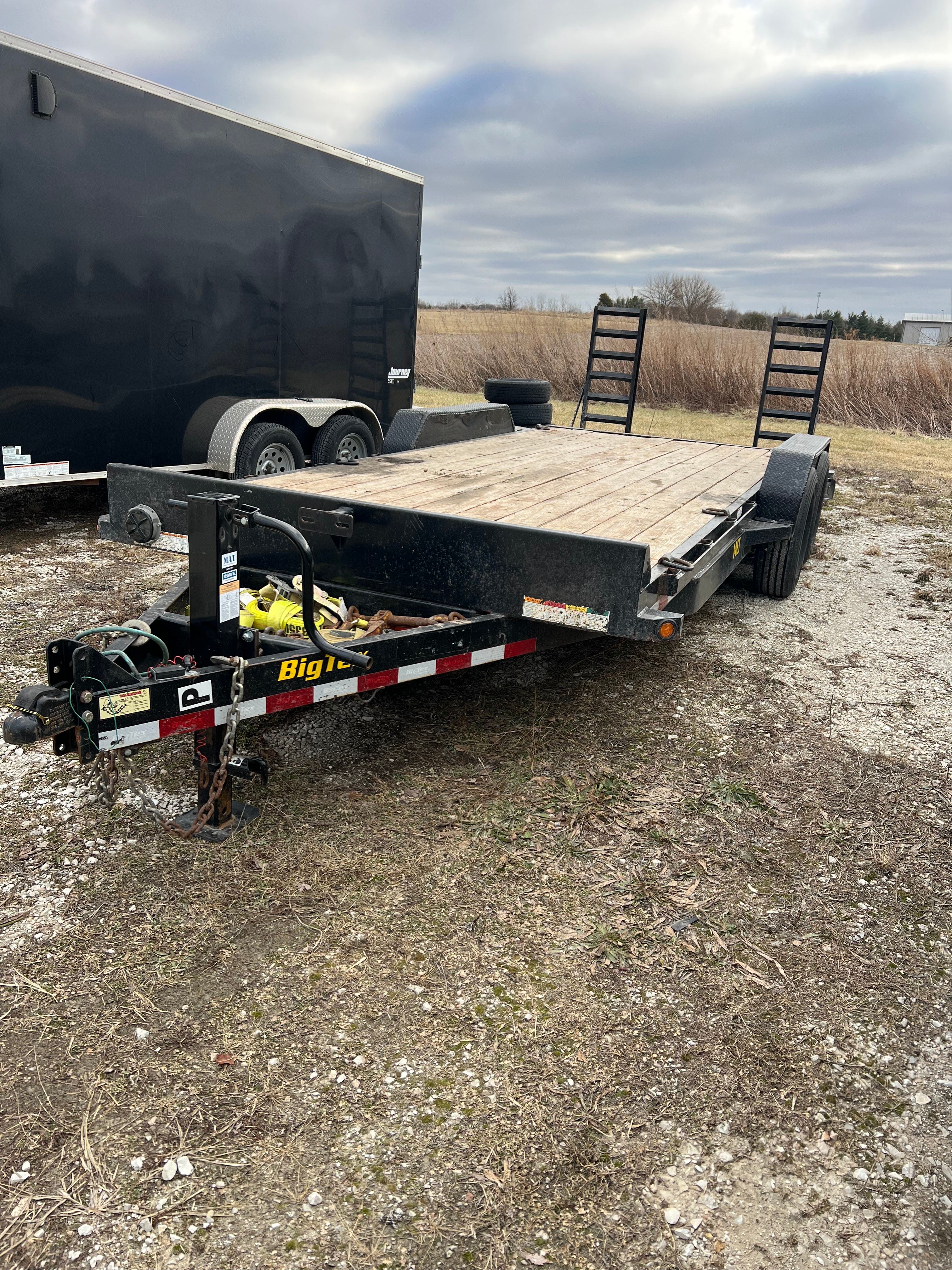 Big Tex flatbed trailer angle view showing ramp storage