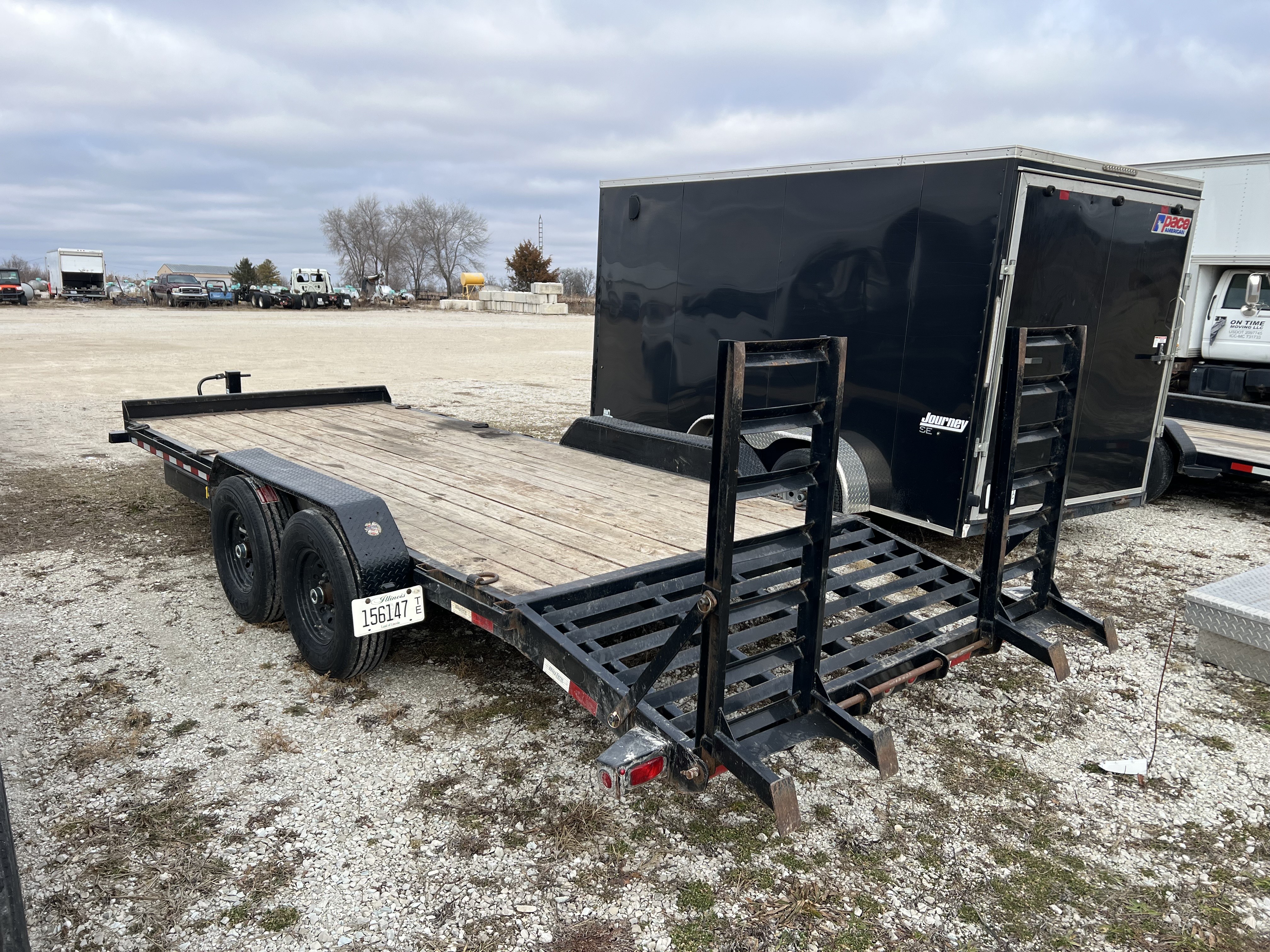 Big Tex equipment trailer with loading ramps deployed