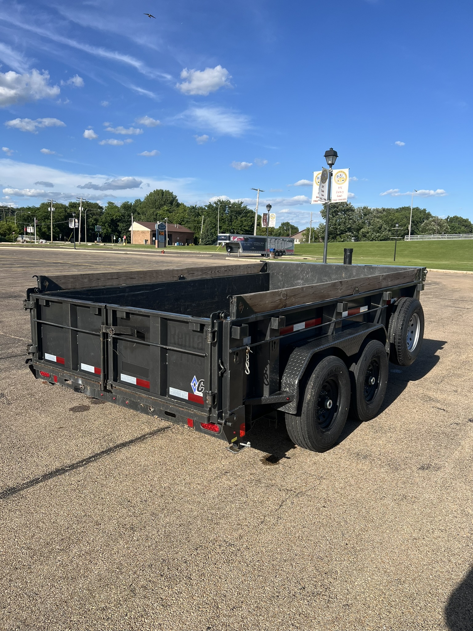Diamond C dump trailer rear 3/4 angle view showing tandem axles
